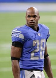 Adrian Peterson of the Detroit Lions watches the action from the sidelines during the fourth quarter of the game against the Minnesota Vikings at...